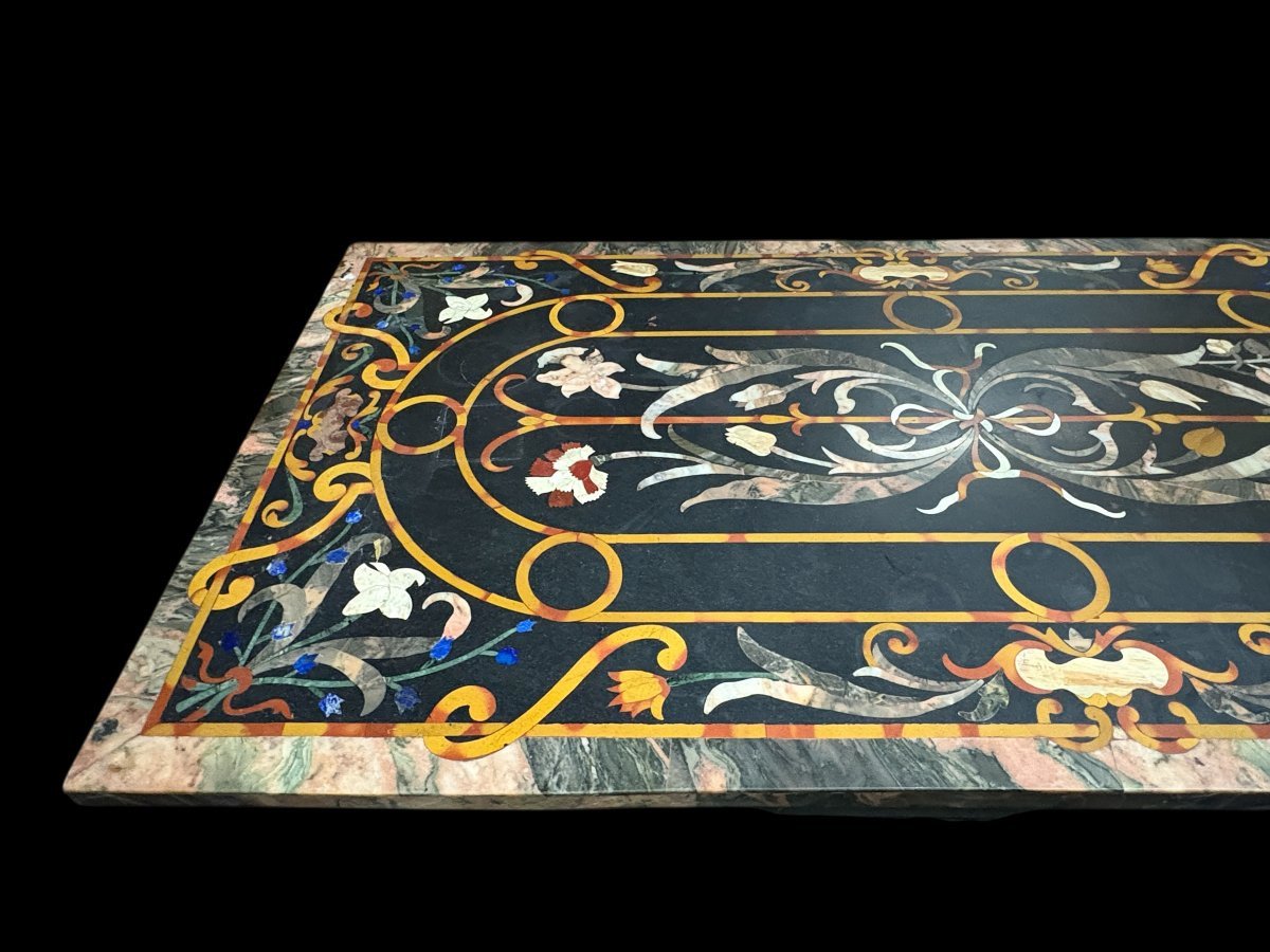 Large Italian marble table with coloured semi-precious stones, 20thC ( 181 x 91 x 78 cm ) Nice 3 cm thick top inlaid with semi-precious stones forming a floral pattern, resting on a black marble base. Highly decorative marble table