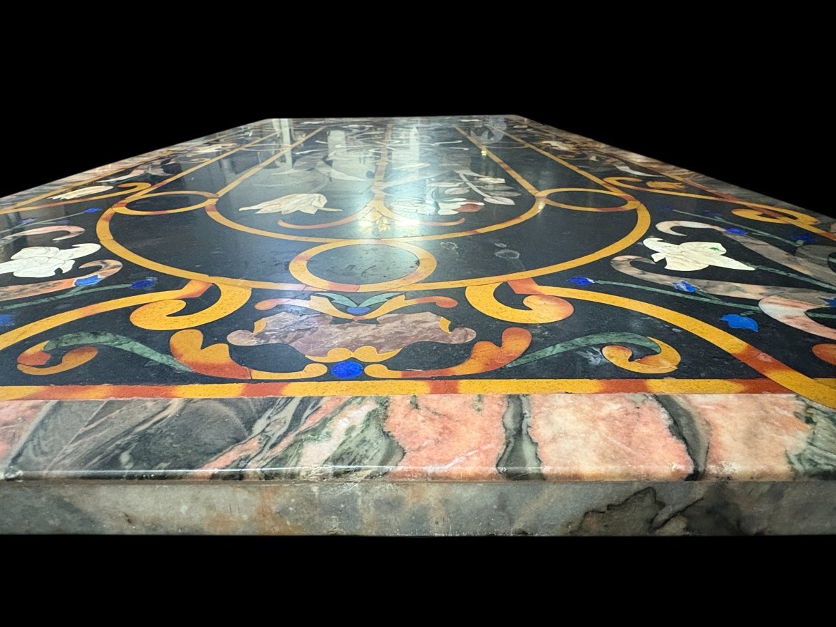 Large Italian marble table with coloured semi-precious stones, 20thC ( 181 x 91 x 78 cm ) Nice 3 cm thick top inlaid with semi-precious stones forming a floral pattern, resting on a black marble base. Highly decorative marble table