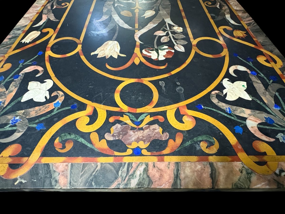 Large Italian marble table with coloured semi-precious stones, 20thC ( 181 x 91 x 78 cm ) Nice 3 cm thick top inlaid with semi-precious stones forming a floral pattern, resting on a black marble base. Highly decorative marble table
