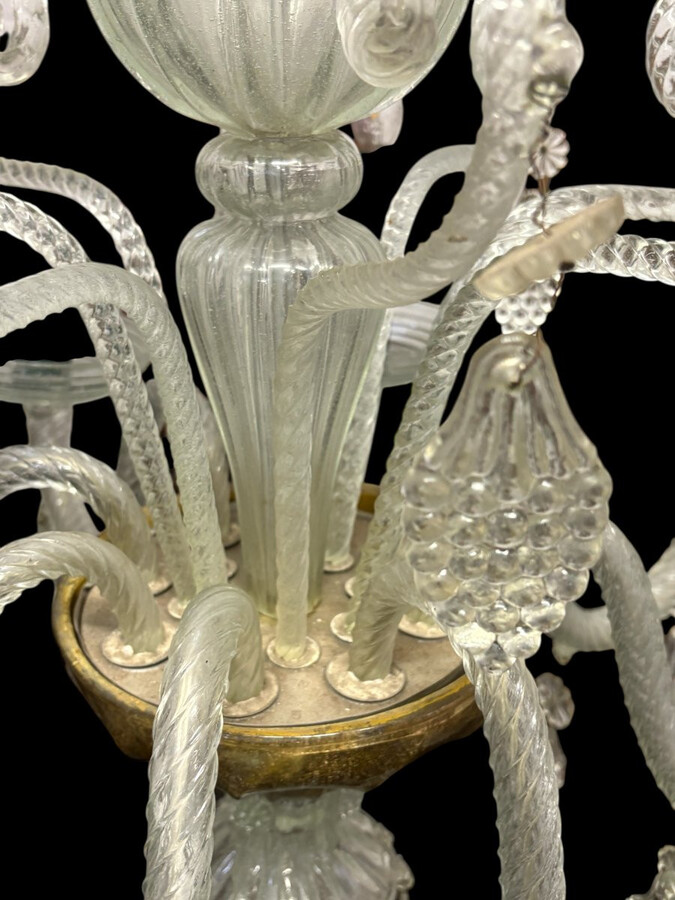 Large Liège chandelier with 8 arms, 19th century (112 cm). Beautiful decorative glass chandelier with 8 large arms featuring light points decorated with small and large scrolls adorned with glass balls, grape cluster-shaped nuggets