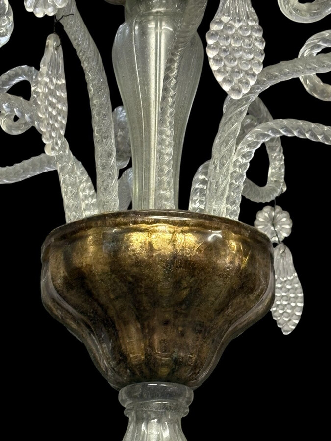 Large Liège chandelier with 8 arms, 19th century (112 cm). Beautiful decorative glass chandelier with 8 large arms featuring light points decorated with small and large scrolls adorned with glass balls, grape cluster-shaped nuggets