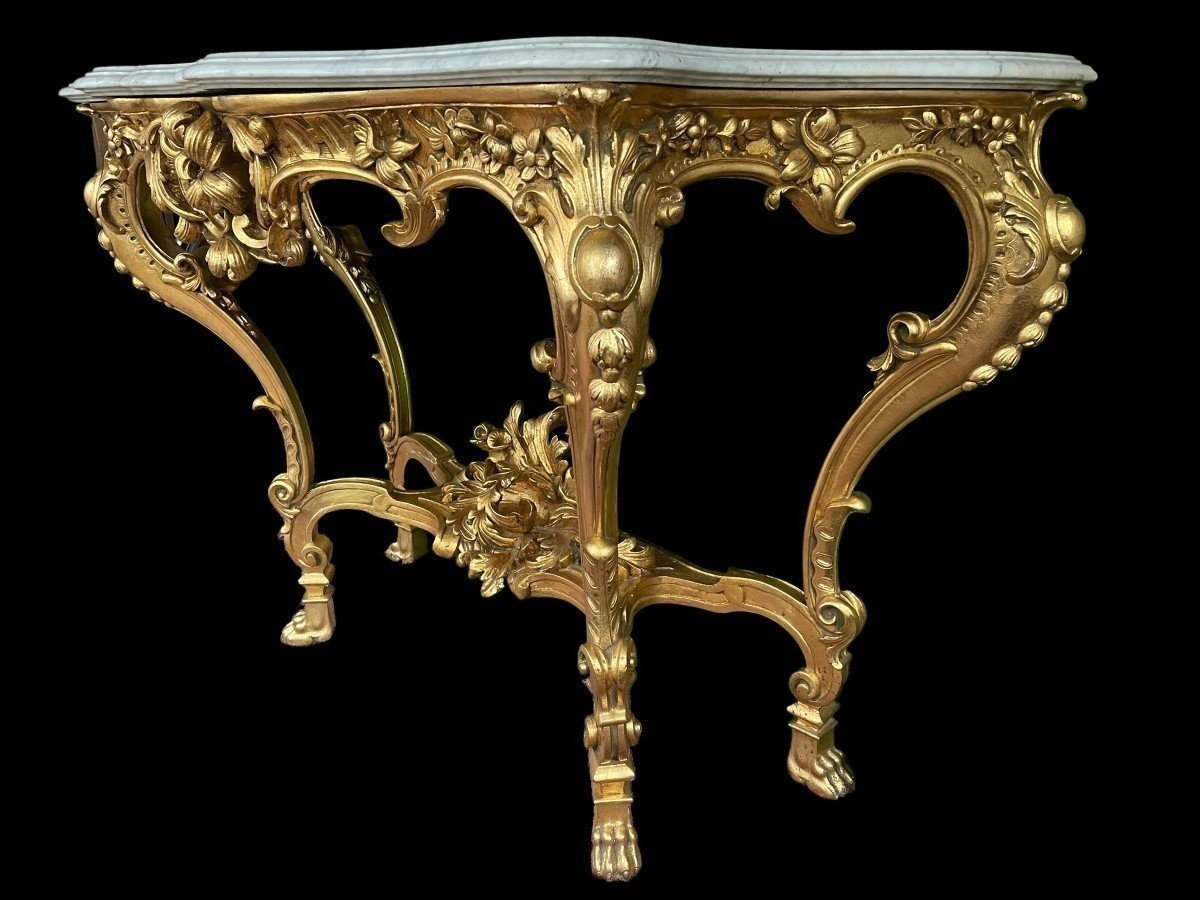 Large Louis XV style 4 legs console in gilded wood/stucco 19th century. Decorative console with a nice thick white marble top. The console and the marble top are in good condition and stand on 4 claw feet. It dates from about 1880-1900.