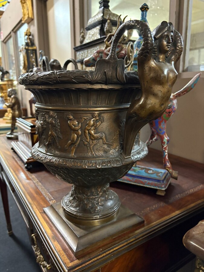 Large ‘Medici’ vase in brown patinated bronze with a procession of Bacchus, 19th century. Decorative vase decorated with a Bacchanalian procession and fitted with handles in the shape of mythological ladies.