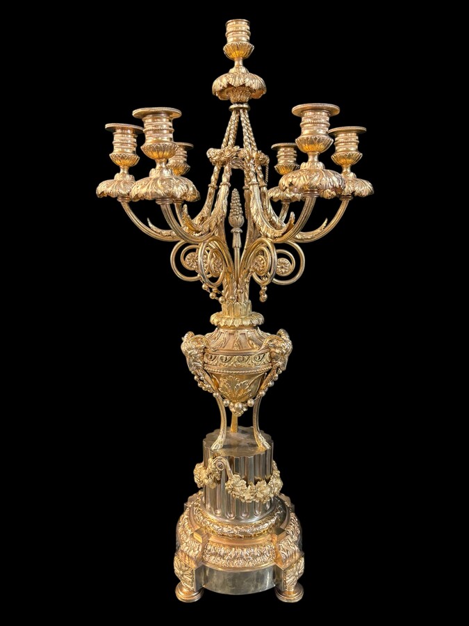 Large ormolu mantel set in the Louis XVI style, 19th century. Beautiful trim in good condition, clockwork to be checked, bell and pendulum missing. Louis Seize style model, candlesticks with 7 candlesticks and the following dimensions: Clock: Height: 64 c
