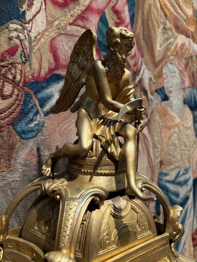 Large pendulum clock in gilt bronze with cut glass 19th century. Representation of Chronos figure , winged Mythological beasts and decorations in bronze working with a suns balance. Richly decorated dial signed R.COTTIN.26 Rue Amelot PARIS
