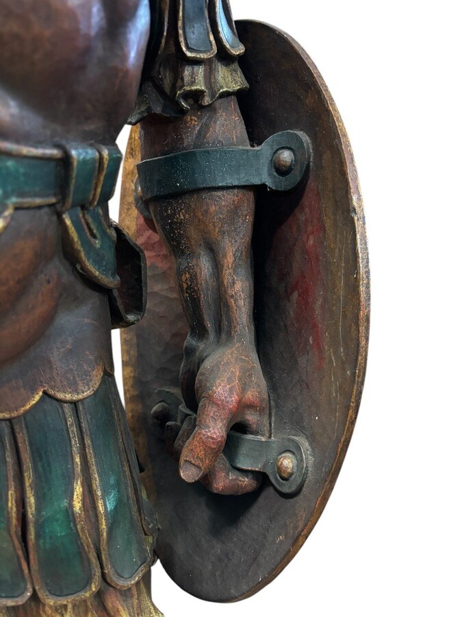 Large polychrome oak sculpture of a soldier/warrior late 19th century Very decorative and detailed carving of a warrior with shield and spear. In very good condition. Dimensions : Height : 109 / 134 cm Width : 49 cm Depth : 39 cm Foot : 26 x 21,5 cm