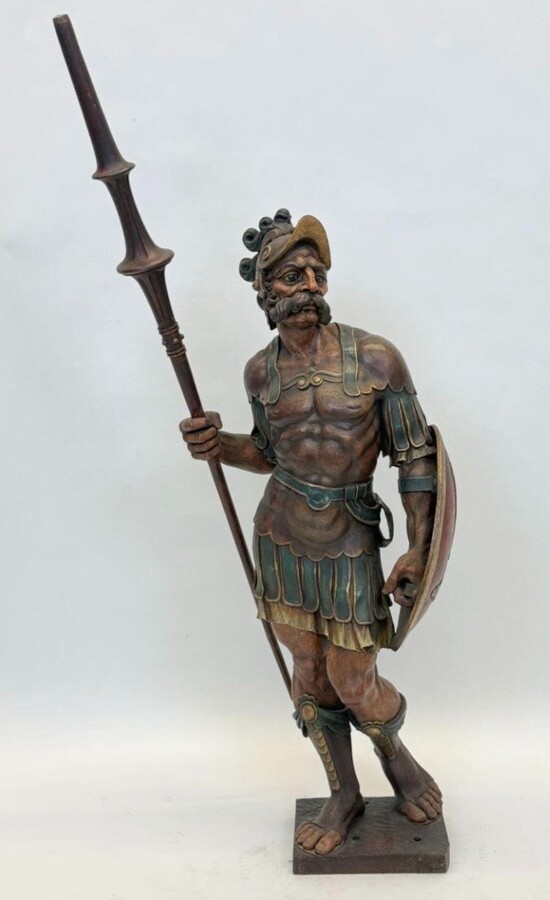 Large polychrome oak sculpture of a soldier/warrior late 19th century Very decorative and detailed carving of a warrior with shield and spear. In very good condition. Dimensions : Height : 109 / 134 cm Width : 49 cm Depth : 39 cm Foot : 26 x 21,5 cm