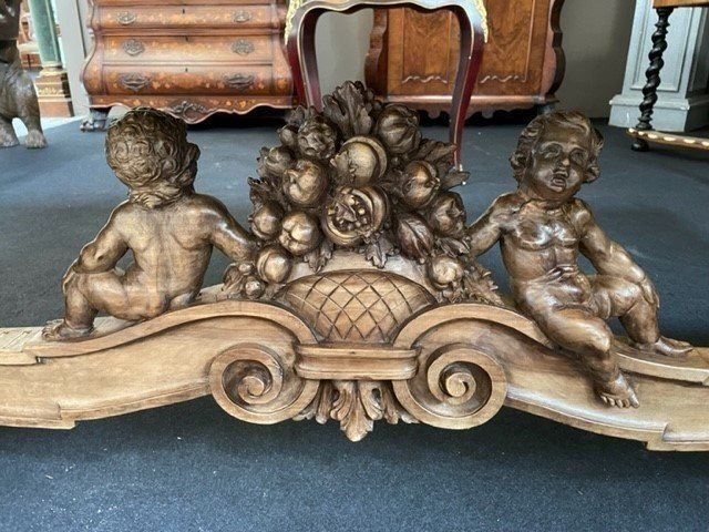 Large Table Style Renaissance In Walnut 19th Century. Very Decorative Table With Large Sculpted Winged Angels , Lion Heads And On The Lower Travers 2 Seated Putti With A Flower Basket. The Table Is In Good Condition