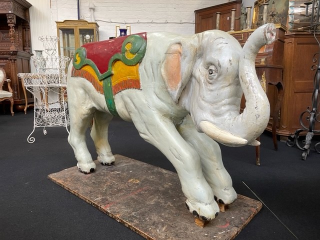 Large wooden elephant of carrousel circa1920. Decorative sculpture of a painted wooden elephant with following dimensions : Width: 148 cm Height: 89 cm Depth: 34 cm Large decorative sculpture in good condition.
