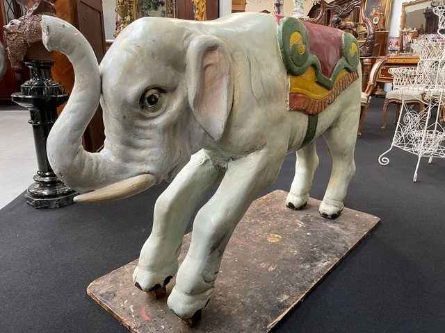 Large wooden elephant of carrousel circa1920. Decorative sculpture of a painted wooden elephant with following dimensions : Width: 148 cm Height: 89 cm Depth: 34 cm Large decorative sculpture in good condition.