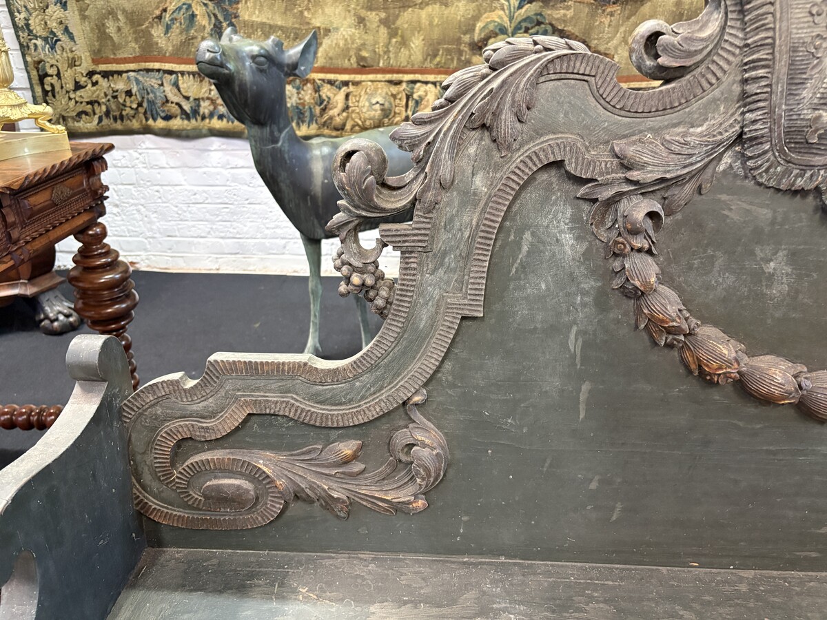 Louis XVI-style wooden hall bench, late 18th century.A highly decorative wooden bench, carved and adorned with flowers, garlands, scrolls, etc. Width: 170 cm In good condition, with normal signs of wear. 