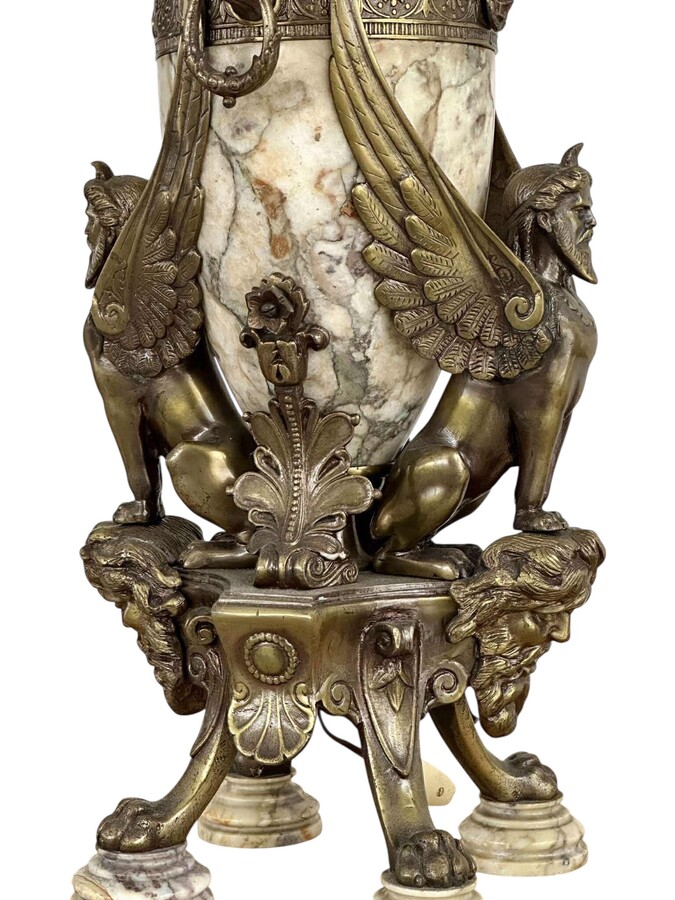‘Mythological Sphinx’ lamp base in bronze/marble, 1920. Decorative lamp base depicting two mythological sphinxes in bronze standing on a bearded man's head leaning against a large marble vase. Small defect