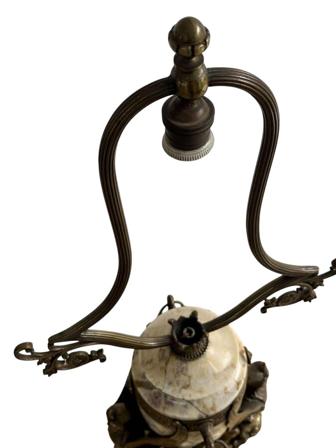‘Mythological Sphinx’ lamp base in bronze/marble, 1920. Decorative lamp base depicting two mythological sphinxes in bronze standing on a bearded man's head leaning against a large marble vase. Small defect