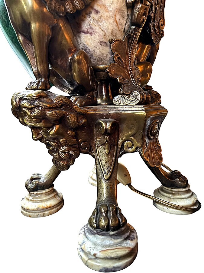 ‘Mythological Sphinx’ lamp base in bronze/marble, 1920. Decorative lamp base depicting two mythological sphinxes in bronze standing on a bearded man's head leaning against a large marble vase. Small defect