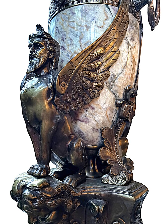 ‘Mythological Sphinx’ lamp base in bronze/marble, 1920. Decorative lamp base depicting two mythological sphinxes in bronze standing on a bearded man's head leaning against a large marble vase. Small defect