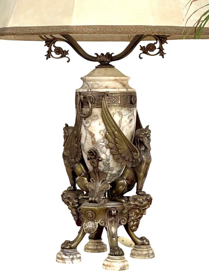 ‘Mythological Sphinx’ lamp base in bronze/marble, 1920. Decorative lamp base depicting two mythological sphinxes in bronze standing on a bearded man's head leaning against a large marble vase. Small defect