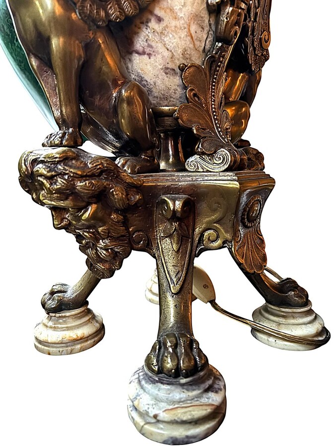 ‘Mythological Sphinx’ lamp base in bronze/marble, 1920. Decorative lamp base depicting two mythological sphinxes in bronze standing on a bearded man's head leaning against a large marble vase. Small defect