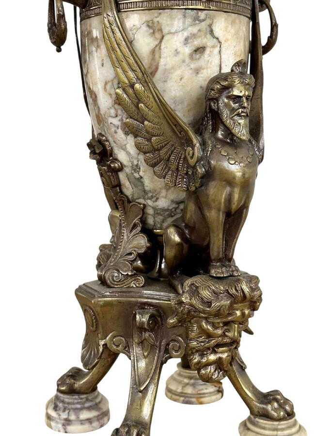 ‘Mythological Sphinx’ lamp base in bronze/marble, 1920. Decorative lamp base depicting two mythological sphinxes in bronze standing on a bearded man's head leaning against a large marble vase. Small defect