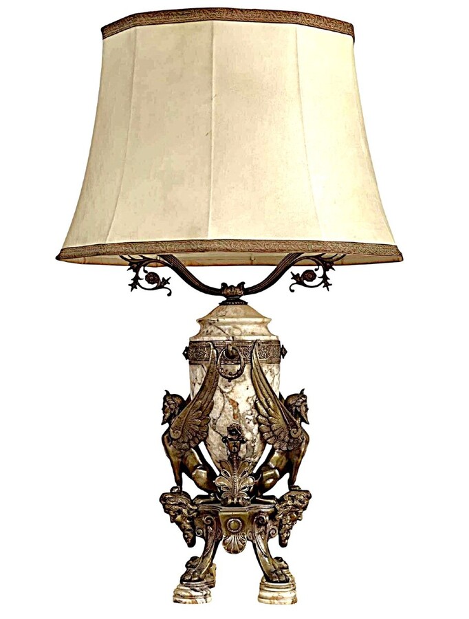 ‘Mythological Sphinx’ lamp base in bronze/marble, 1920. Decorative lamp base depicting two mythological sphinxes in bronze standing on a bearded man's head leaning against a large marble vase. Small defect