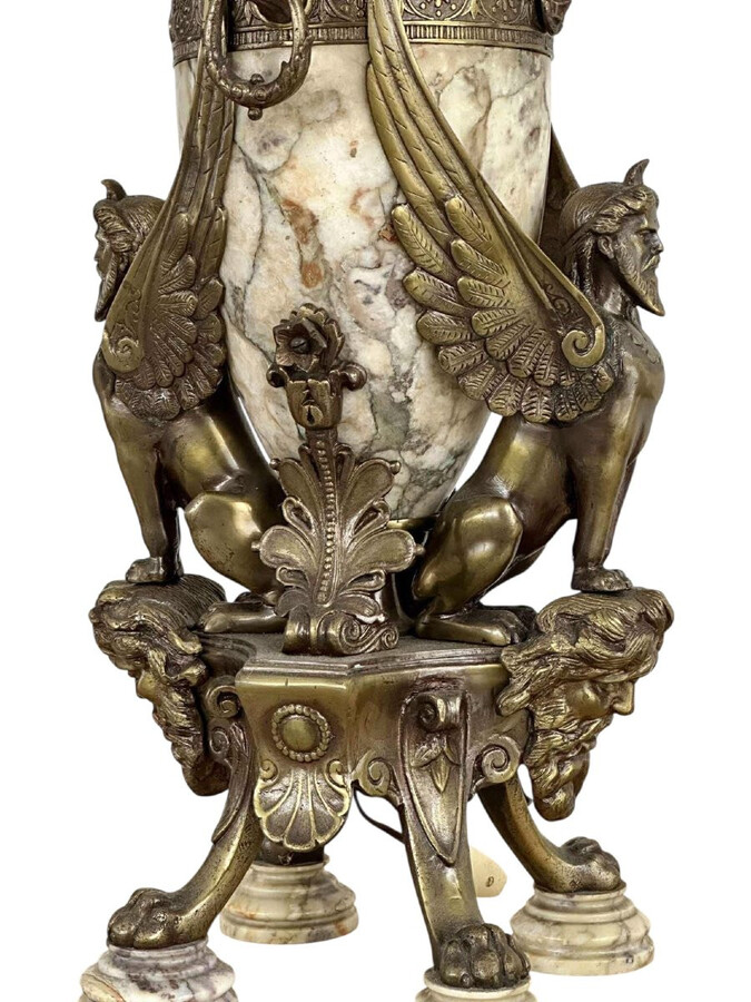 ‘Mythological Sphinx’ lamp base in bronze/marble, 1920. Decorative lamp base depicting two mythological sphinxes in bronze standing on a bearded man's head leaning against a large marble vase. Small defect