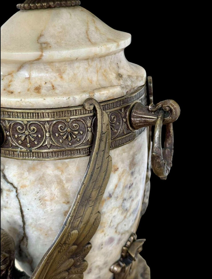 ‘Mythological Sphinx’ lamp base in bronze/marble, 1920. Decorative lamp base depicting two mythological sphinxes in bronze standing on a bearded man's head leaning against a large marble vase. Small defect