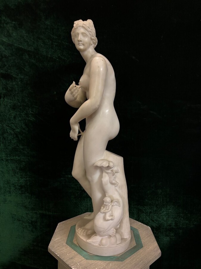 Nice alabaster sculpture from the 19th century. ( 79 cm ) Beautiful alabaster sculpture finely detailed representing Venus with a fish and 2 angels playing. Signed on the base at the back Dimensions : Height : 79 cm Width : 26 cm Foot diameter : 21 cm