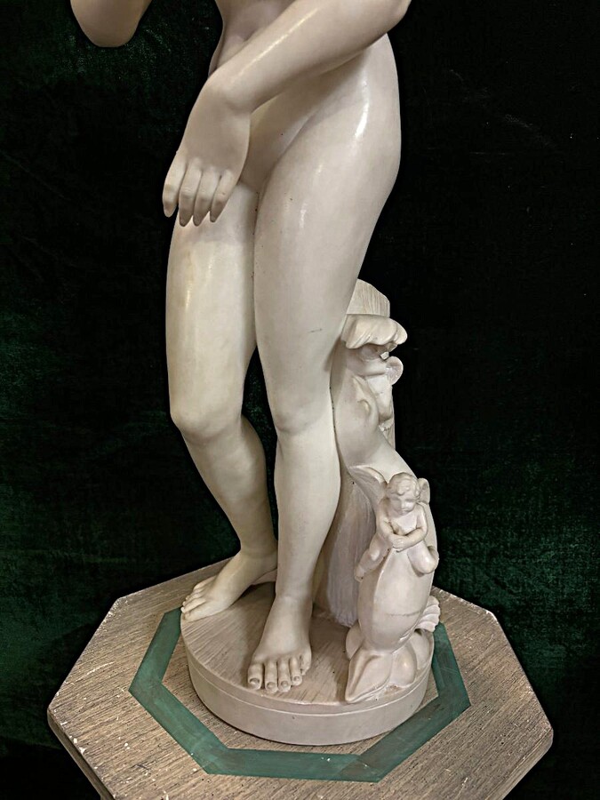 Nice alabaster sculpture from the 19th century. ( 79 cm ) Beautiful alabaster sculpture finely detailed representing Venus with a fish and 2 angels playing. Signed on the base at the back Dimensions : Height : 79 cm Width : 26 cm Foot diameter : 21 cm