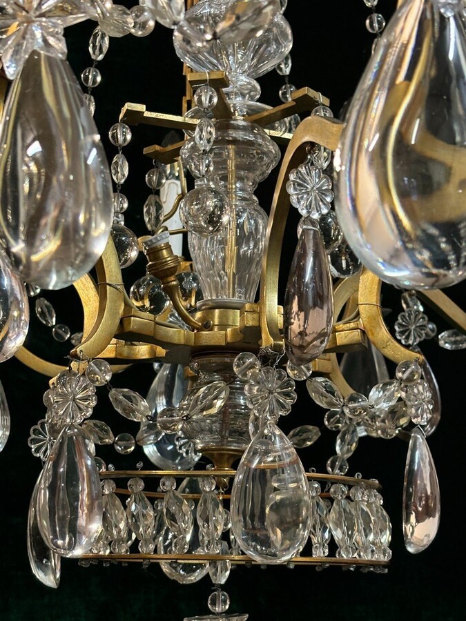 Nice Large Chandelier In Bronze And Crystal Late 19th Century. The Chandelier Has 10 Light Points On The Outer Rim And 6 Light Points Inside. Wiring Has Been Renewed And Is Therefore In Good Condition.