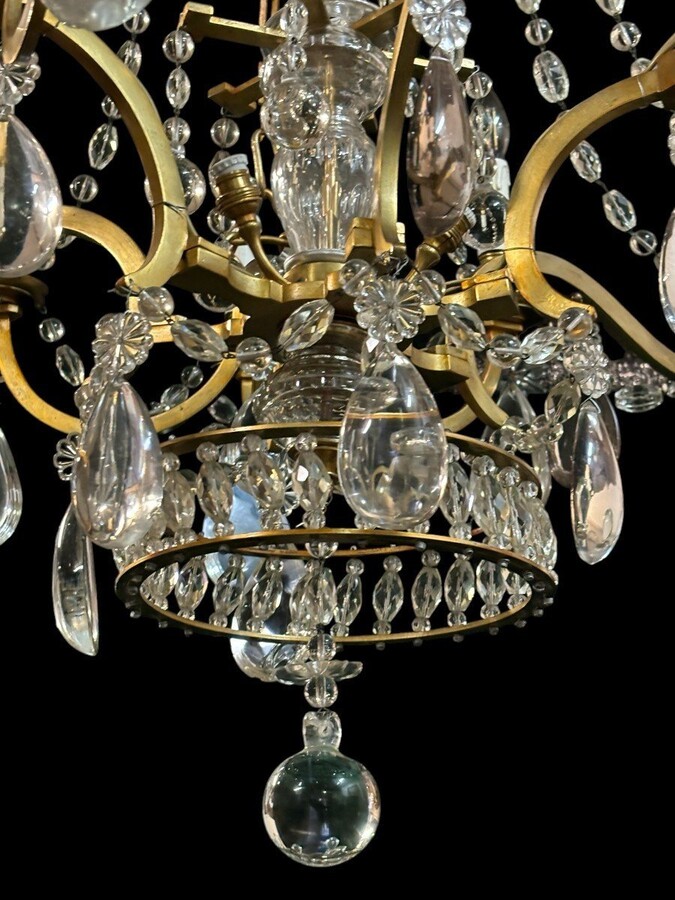 Nice Large Chandelier In Bronze And Crystal Late 19th Century. The Chandelier Has 10 Light Points On The Outer Rim And 6 Light Points Inside. Wiring Has Been Renewed And Is Therefore In Good Condition.