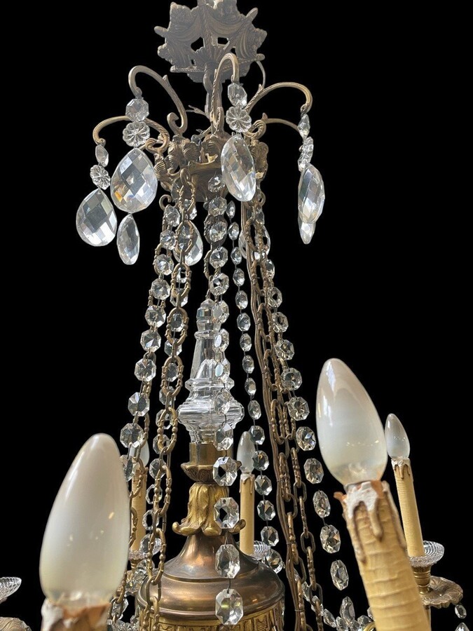 Nice, Late 19th Century LXVI Style Bronze/Crystal Chandelier. Bronze Frame Decorated With 10 Arms/Luminous Points, Bronze Decorative Elements, A Crystal Spike At The Top And Numerous Crystal Spokes. Dimensions: Height : 106 Cm Width : 80 Cm