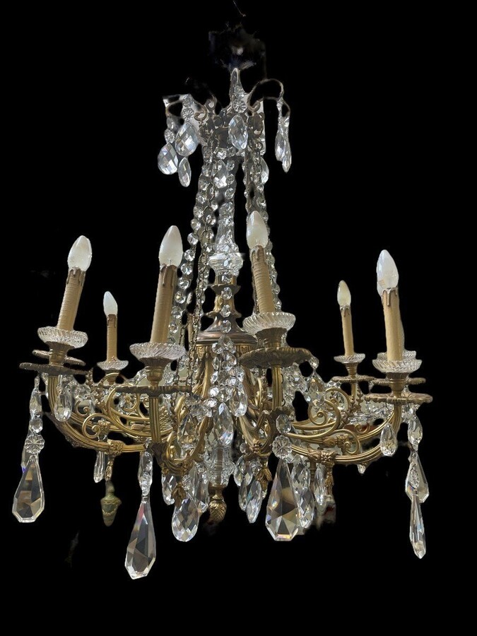 Nice, Late 19th Century LXVI Style Bronze/Crystal Chandelier. Bronze Frame Decorated With 10 Arms/Luminous Points, Bronze Decorative Elements, A Crystal Spike At The Top And Numerous Crystal Spokes. Dimensions: Height : 106 Cm Width : 80 Cm