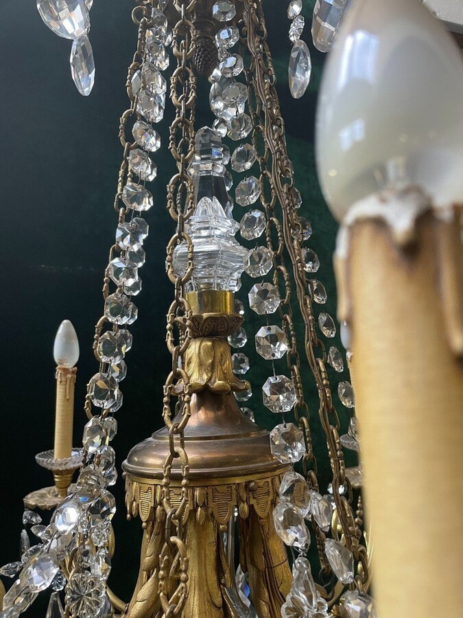 Nice, Late 19th Century LXVI Style Bronze/Crystal Chandelier. Bronze Frame Decorated With 10 Arms/Luminous Points, Bronze Decorative Elements, A Crystal Spike At The Top And Numerous Crystal Spokes. Dimensions: Height : 106 Cm Width : 80 Cm