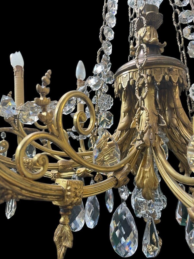 Nice, Late 19th Century LXVI Style Bronze/Crystal Chandelier. Bronze Frame Decorated With 10 Arms/Luminous Points, Bronze Decorative Elements, A Crystal Spike At The Top And Numerous Crystal Spokes. Dimensions: Height : 106 Cm Width : 80 Cm