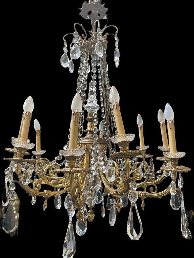 Nice, Late 19th Century LXVI Style Bronze/Crystal Chandelier. Bronze Frame Decorated With 10 Arms/Luminous Points, Bronze Decorative Elements, A Crystal Spike At The Top And Numerous Crystal Spokes. Dimensions: Height : 106 Cm Width : 80 Cm
