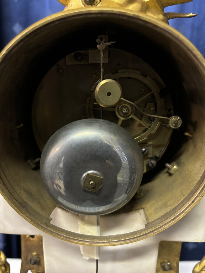 Nice Louis XVI style clock in marble and gilt bronze 18th century Elegant mantel clock decorated with gilt bronze ornaments, women's heads, birds, foliage and its original sundial. Minor old restoration to the marble base. Dimensions : Height: 41 cm