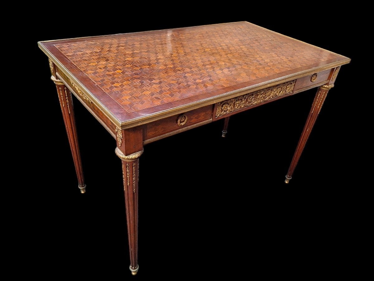 Nice Louis XVI style coffee table/desk after Jean-Henri Riesener, 19th century. High-quality desk with parquet top, equipped with a large drawer and decorated with very refined bronze decorations and ornaments.