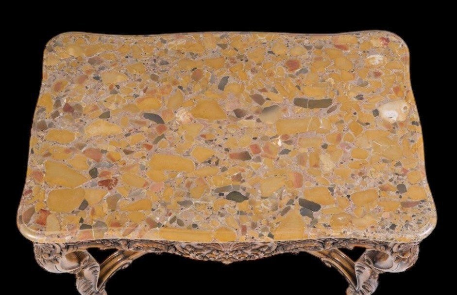 Ornately carved wooden coffee table with a marble top, circa 1920. Attractive oak coffee table/console with a Breche d'Aleppo marble top. Dimensions: Height: 80 cm. Width: 100 cm. Depth: 60 cm. In very good condition.