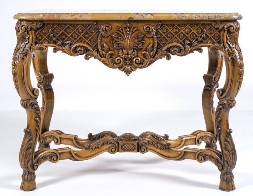 Ornately carved wooden coffee table with a marble top, circa 1920. Attractive oak coffee table/console with a Breche d'Aleppo marble top. Dimensions: Height: 80 cm. Width: 100 cm. Depth: 60 cm. In very good condition.