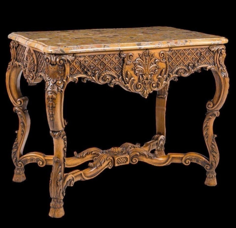 Ornately carved wooden coffee table with a marble top, circa 1920. Attractive oak coffee table/console with a Breche d'Aleppo marble top. Dimensions: Height: 80 cm. Width: 100 cm. Depth: 60 cm. In very good condition.