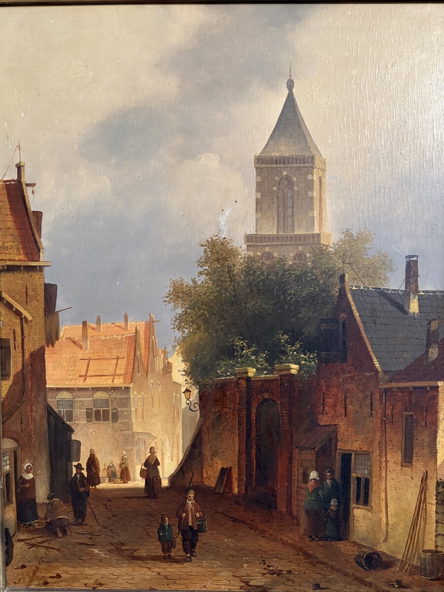 Painting ‘View of an Old Dutch Town’ oil on panel, 19th century Decorative painting in a large gilded frame depicting an old town, a street with old houses, a church, a gate with a municipal garden and various figures. 