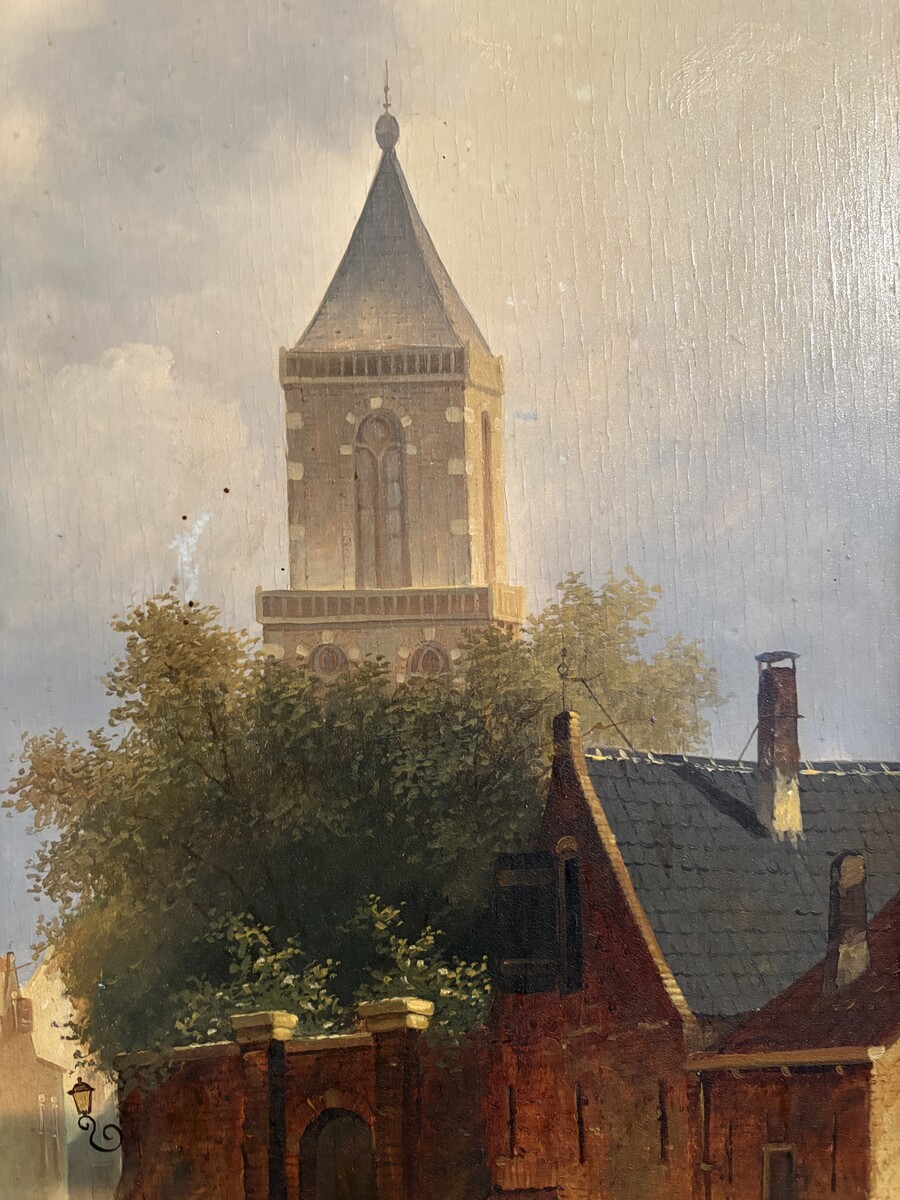 Painting ‘View of an Old Dutch Town’ oil on panel, 19th century Decorative painting in a large gilded frame depicting an old town, a street with old houses, a church, a gate with a municipal garden and various figures. 