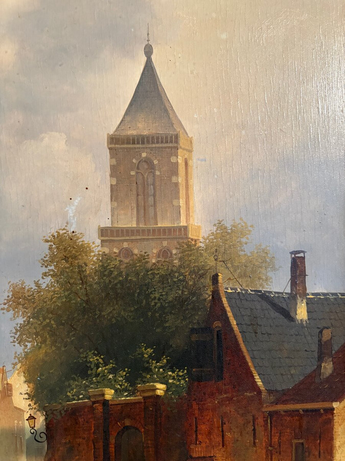 Painting ‘View of an Old Dutch Town’ oil on panel, 19th century Decorative painting in a large gilded frame depicting an old town, a street with old houses, a church, a gate with a municipal garden and various figures.