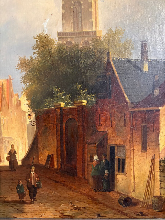 Painting ‘View of an Old Dutch Town’ oil on panel, 19th century Decorative painting in a large gilded frame depicting an old town, a street with old houses, a church, a gate with a municipal garden and various figures.