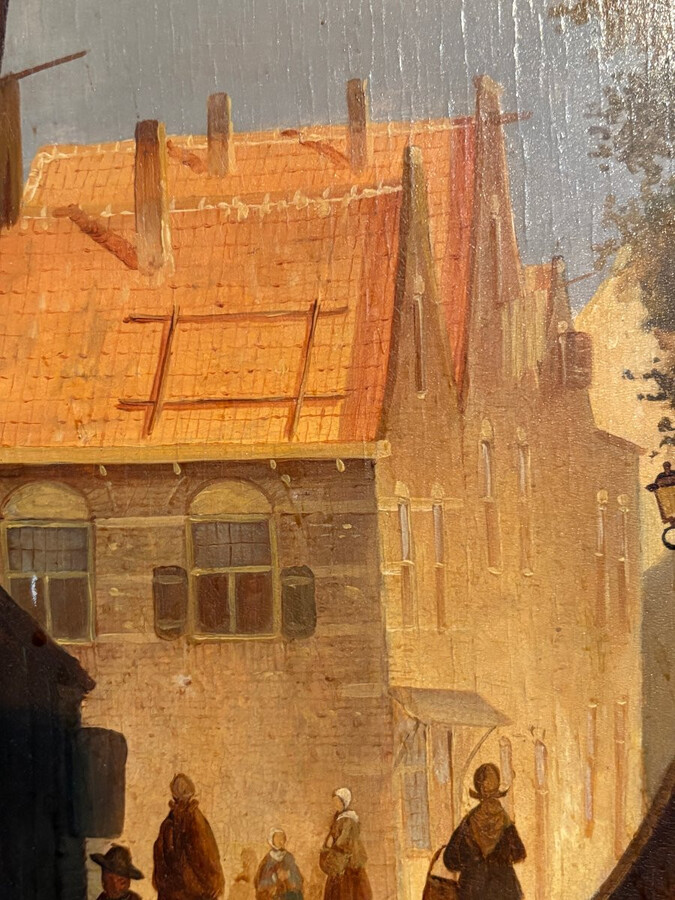 Painting ‘View of an Old Dutch Town’ oil on panel, 19th century Decorative painting in a large gilded frame depicting an old town, a street with old houses, a church, a gate with a municipal garden and various figures.