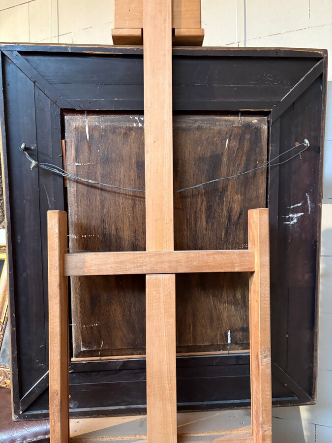 Painting ‘View of an Old Dutch Town’ oil on panel, 19th century Decorative painting in a large gilded frame depicting an old town, a street with old houses, a church, a gate with a municipal garden and various figures.