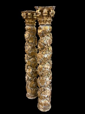 Pair of 17th-century Baroque twisted columns Highly decorative columns adorned with vines, birds and Corinthian capitals covered with antique gilding and polychrome decoration Columns in good condition with wear to the wood, gilding and polychrome.