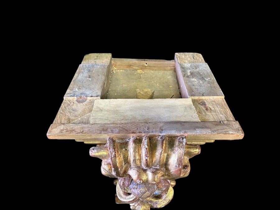 Pair of 17th-century Italian Baroque consoles. Decorative consoles carved in wood, gilded/polychrome, with garlands, fruit, angel heads and decorative ornaments. Ideal for creating a beautiful wall console. Both are in good condition, with normal signs of