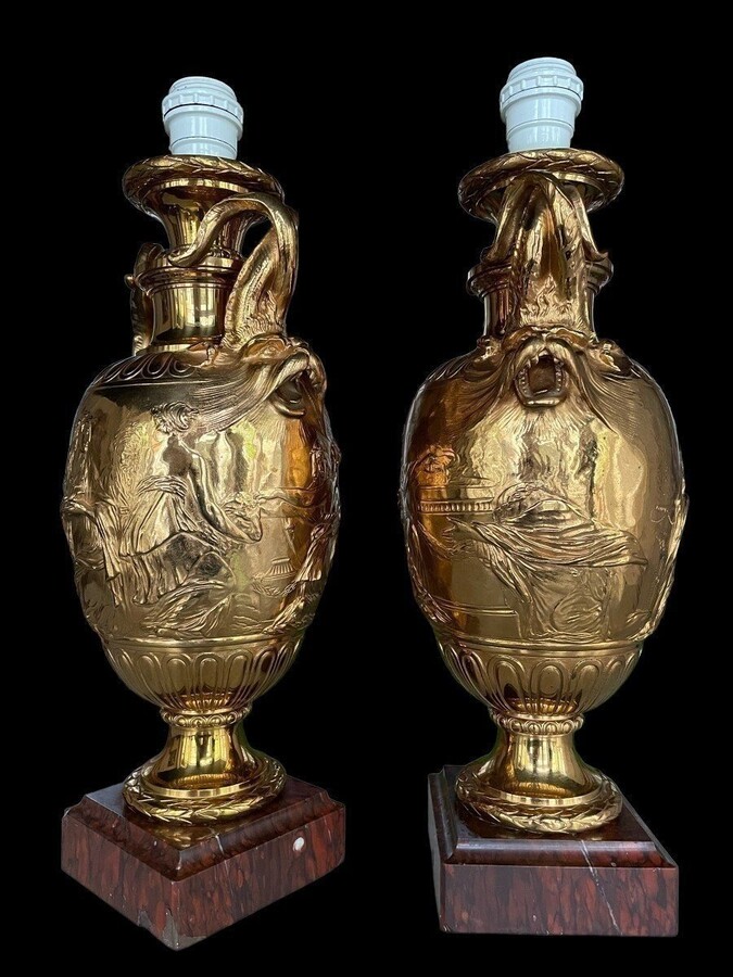 Pair of 19th century F.Barbedienne bronze lamp bases. Decorative lamp bases in the Greek/Roman style resting on a coloured marble base (1 base slightly damaged). Wiring missing. Height : 48 cm Width : 18 cm Base: 12 x 12 cm Signed Ferdinand Barbedienne