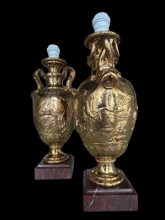 Pair of 19th century F.Barbedienne bronze lamp bases. Decorative lamp bases in the Greek/Roman style resting on a coloured marble base (1 base slightly damaged). Wiring missing. Height : 48 cm Width : 18 cm Base: 12 x 12 cm Signed Ferdinand Barbedienne