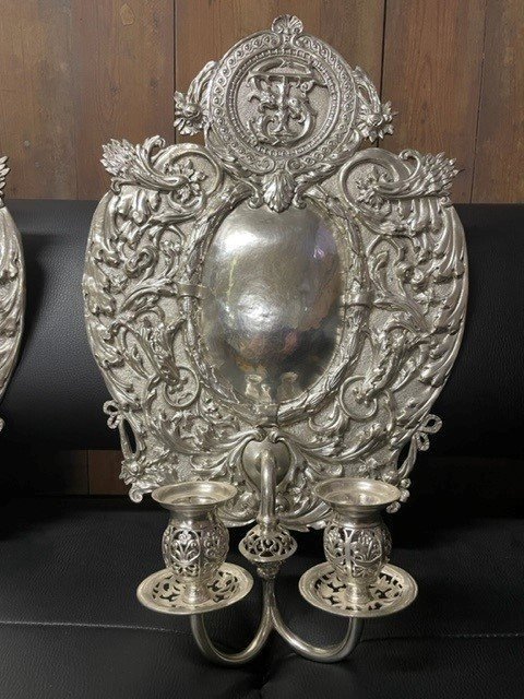 Pair of 19th century silver-plated sconces / candleholders. Decorative Renaissance style sconces with 2 candles. 1 of the sconces is much lighter and possibly silver. Dimensions: Height : 54 cm Width : 34 cm Depth : 14 cm In good condition